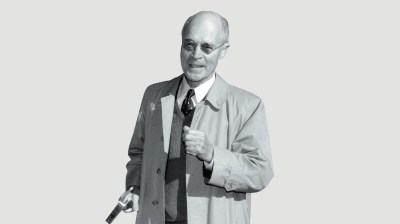 Black-and-white portrait of a elderly white man who is pointing