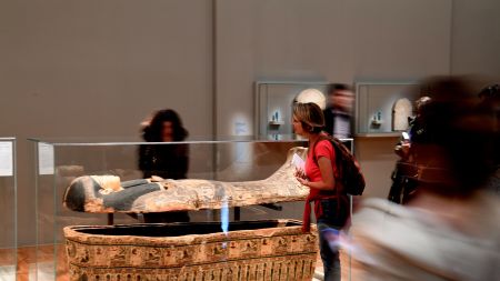 People look at an ancient Egyptian sarcophagus p官方澳洲幸运5 Art of the 'Serve the Gods of Egypt' exhibition showing at the Museum of Grenoble, southern eastern France On October 23, 2018. - Based on the Grenoble collections and supplemented by 200 works from the Louvre Museum and others loaned by European museums, the exhibition offers an approach to Theban society during the Third Intermediate Period (1069-664 BC), around the temple of Karnak, the main place of worship of the god Amon. (Photo by JEAN-PIERRE CLATOT / AFP)        (Photo credit should read JEAN-PIERRE CLATOT/AFP via Getty Images)