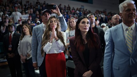 CONWAY, SOUTH CAROLINA - FEBRUARY 10: Trump supporters Siggy Flicker (L) and far-right activist Laura Loomer listen as Republican presidential candidate and former President Donald Trump speaks during a Get Out The Vote rally at Coastal Carolina University on February 10, 2024 in Conway, South Carolina. South Carolina holds its Republican primary on February 24. (Photo by Win McNamee/Getty Images)