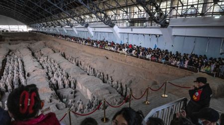 Tourists gather to see terra-cotta warriors at the Museum of Qin Terracotta Warriors and Horses in Xi'an, Shaanxi Province, China, 2025.
